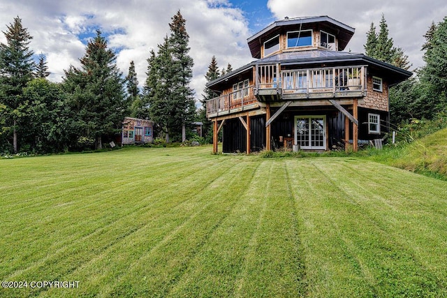 38126 Bobby Rufus Rd, Homer, AK 99603 - back of property featuring a lawn and a wooden deck