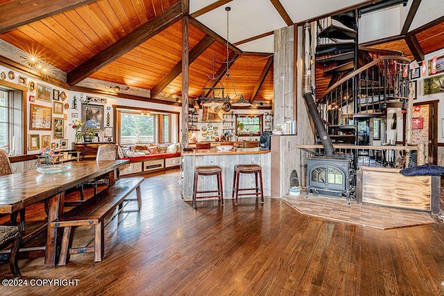 38126 Bobby Rufus Rd, Homer, AK 99603 - living area featuring wood-type flooring, a wood stove, wood ceiling, and stairway