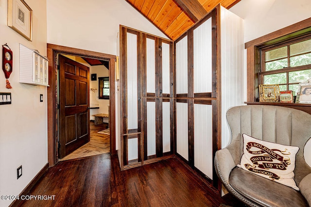 interior space with wood ceiling, vaulted ceiling, and dark hardwood / wood-style flooring