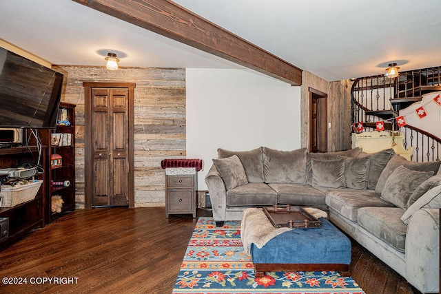 living room featuring wood walls and dark hardwood / wood-style flooring