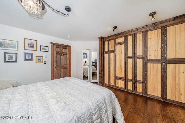 bedroom featuring dark hardwood / wood-style flooring