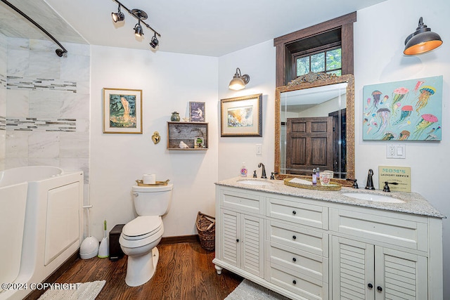 full bathroom with wood-type flooring, vanity, toilet, and separate shower and tub