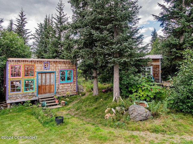38126 Bobby Rufus Rd, Homer, AK 99603 - view of yard featuring entry steps and an outbuilding