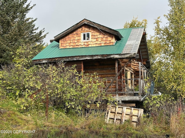 38126 Bobby Rufus Rd, Homer, AK 99603 - view of side of home featuring metal roof