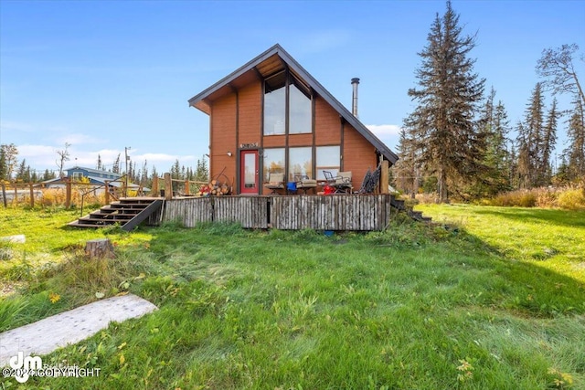 34464 Fishermans Rd, Soldotna, AK 99669 - rear view of property featuring a deck and a lawn