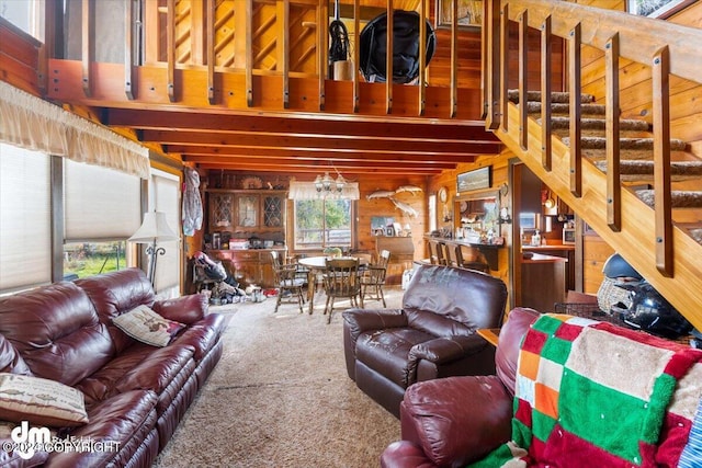 34464 Fishermans Rd, Soldotna, AK 99669 - carpeted living area with beam ceiling and stairs