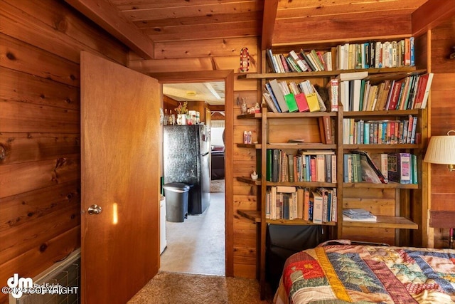 34464 Fishermans Rd, Soldotna, AK 99669 - bedroom featuring freestanding refrigerator, carpet floors, and wooden walls
