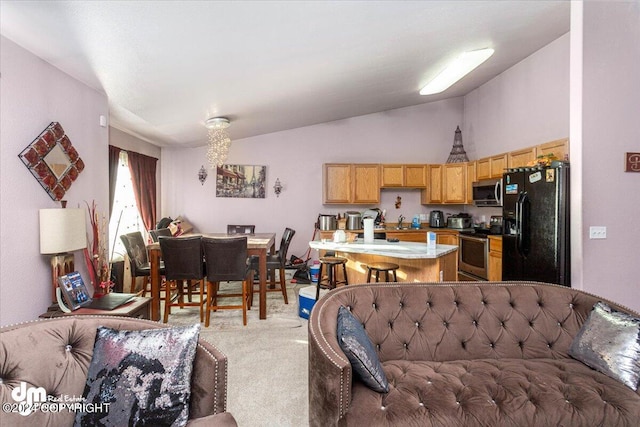 living room featuring vaulted ceiling and light colored carpet