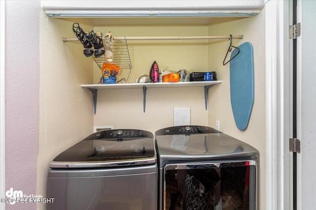 laundry area with separate washer and dryer