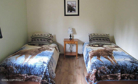 42781 Brenda Way, Soldotna, AK 99669 - bedroom featuring wood finished floors