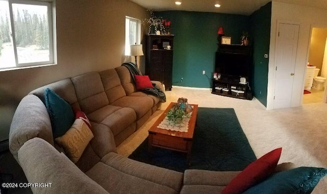 living room featuring carpet flooring and a wealth of natural light