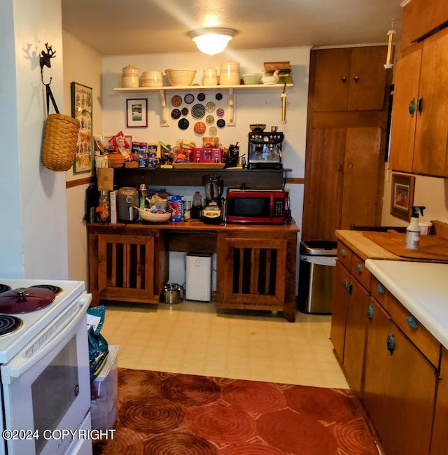 kitchen with white range with electric stovetop