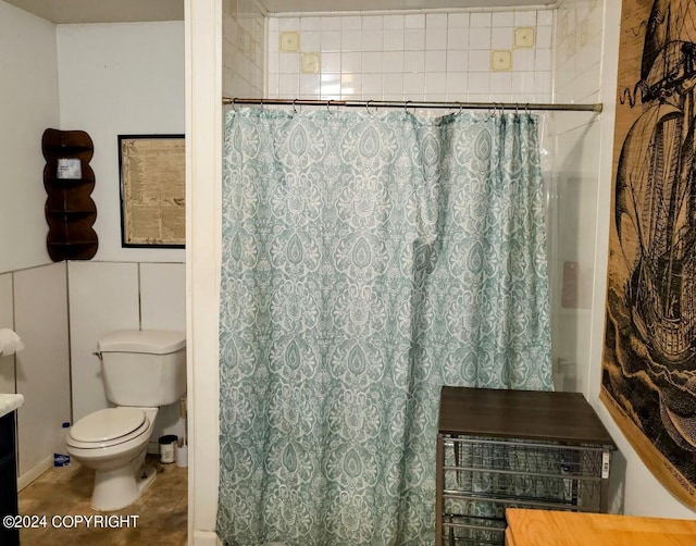 bathroom featuring walk in shower and toilet