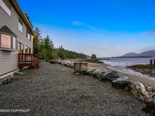 view of yard featuring a deck with water view