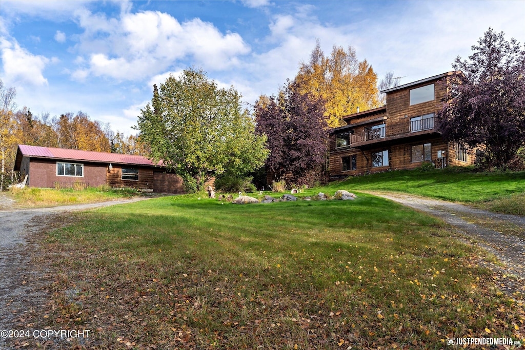 view of property's community with a yard