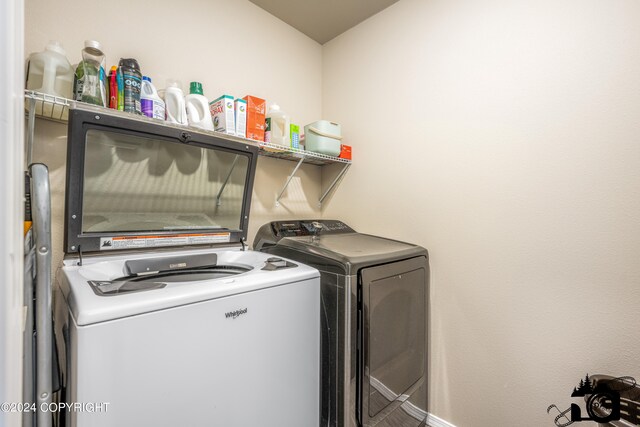 clothes washing area with laundry area and washing machine and clothes dryer