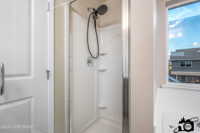 bathroom with a shower stall