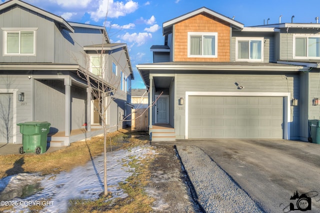 view of front of property with a garage and driveway