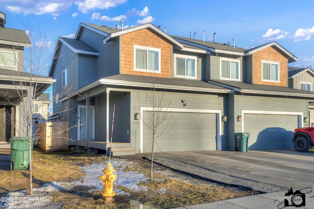 view of front of property with a garage and concrete driveway