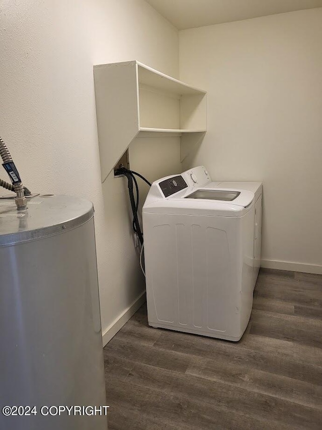 washroom with washer and clothes dryer and dark hardwood / wood-style flooring