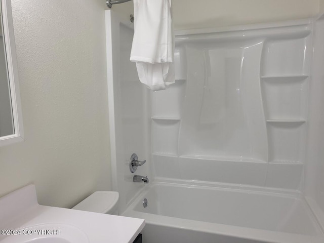 full bathroom featuring vanity, toilet, and bathtub / shower combination