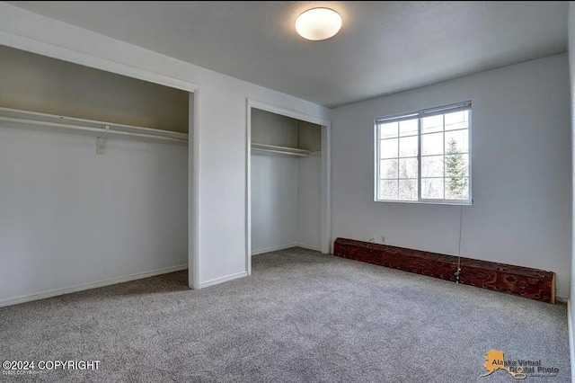 unfurnished bedroom featuring carpet flooring