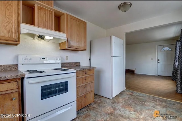 kitchen featuring white appliances and light wood-type flooring