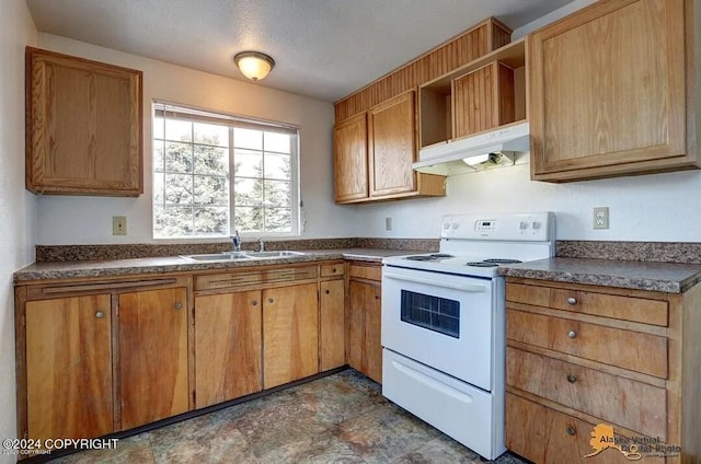 kitchen with sink, white electric range oven, and a textured ceiling