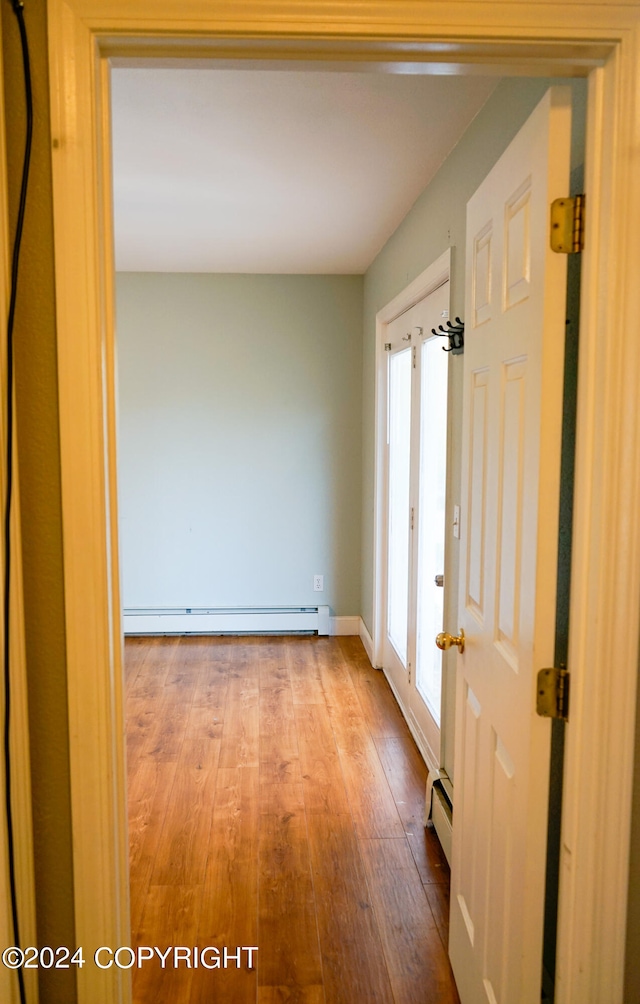 interior space featuring a baseboard radiator and light wood-type flooring