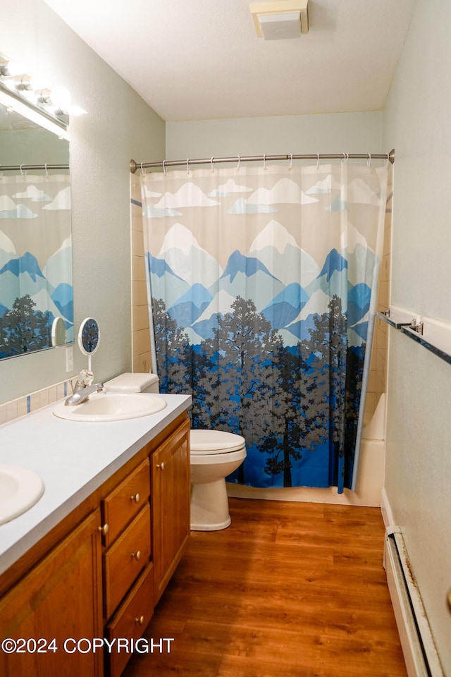 bathroom featuring vanity, wood-type flooring, a baseboard heating unit, toilet, and a shower with shower curtain