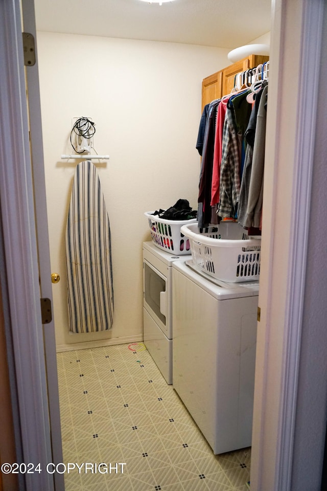 clothes washing area featuring separate washer and dryer