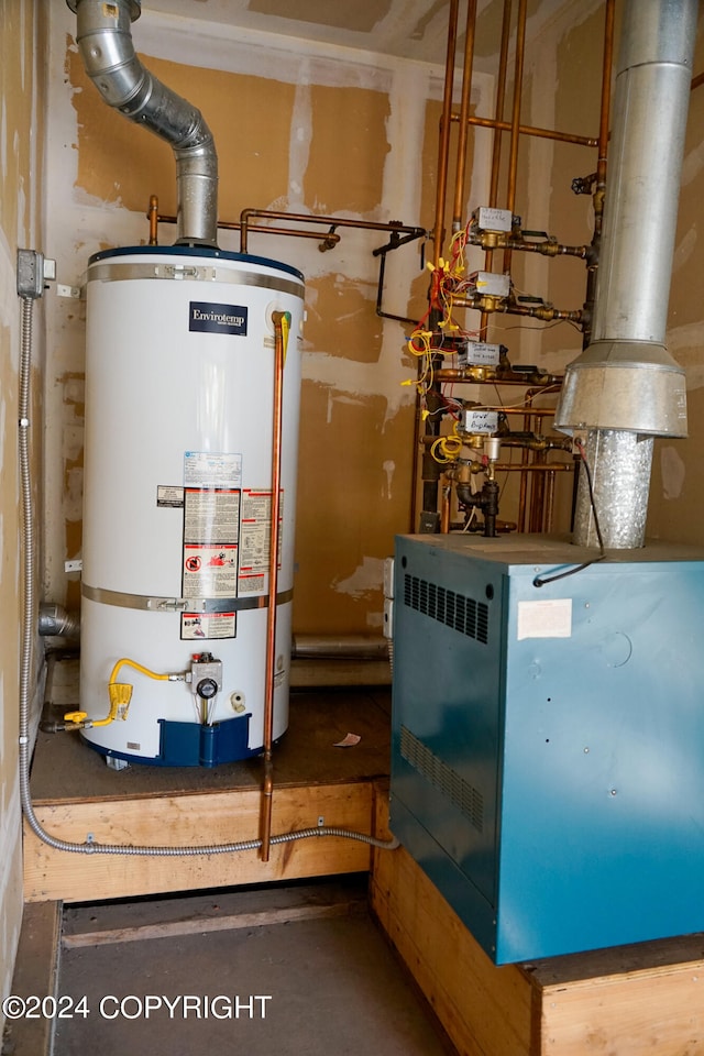 utility room featuring gas water heater