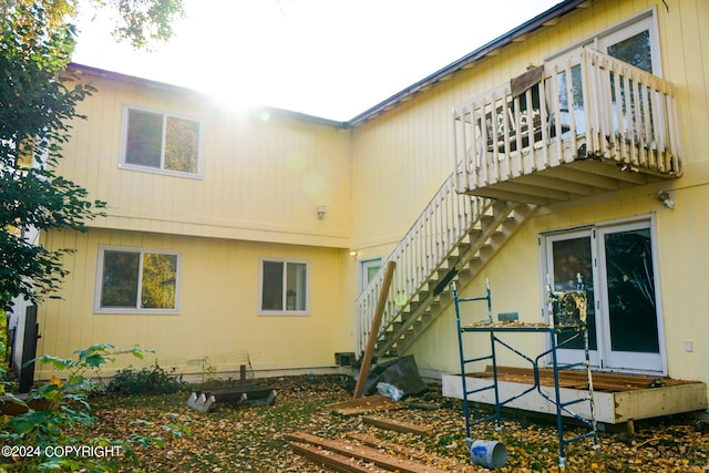 back of property featuring a balcony