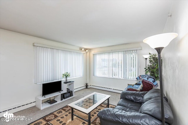 carpeted living room with a baseboard heating unit