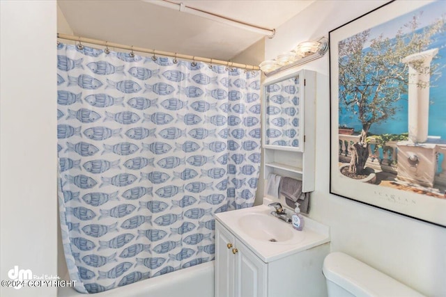 full bathroom featuring shower / bath combination with curtain, vanity, and toilet