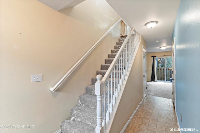 stairway with carpet floors