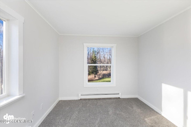 empty room featuring ornamental molding, a baseboard heating unit, and carpet floors