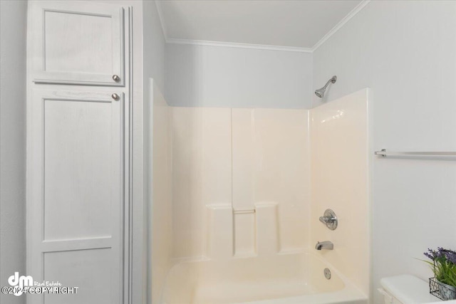 bathroom featuring toilet, ornamental molding, and washtub / shower combination