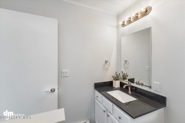 bathroom with vanity and crown molding