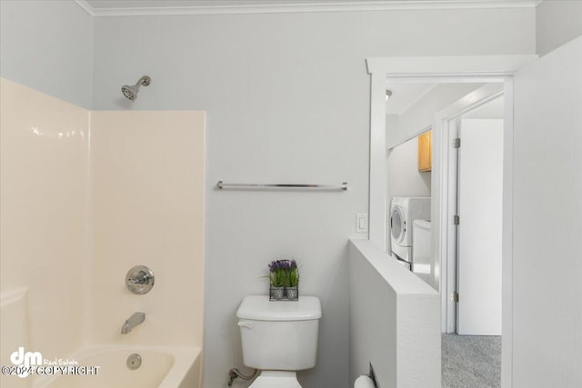 bathroom with separate washer and dryer, shower / bathing tub combination, and toilet