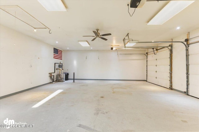 garage featuring a garage door opener and ceiling fan