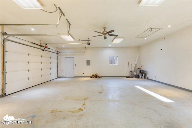 garage with electric panel, a garage door opener, and ceiling fan