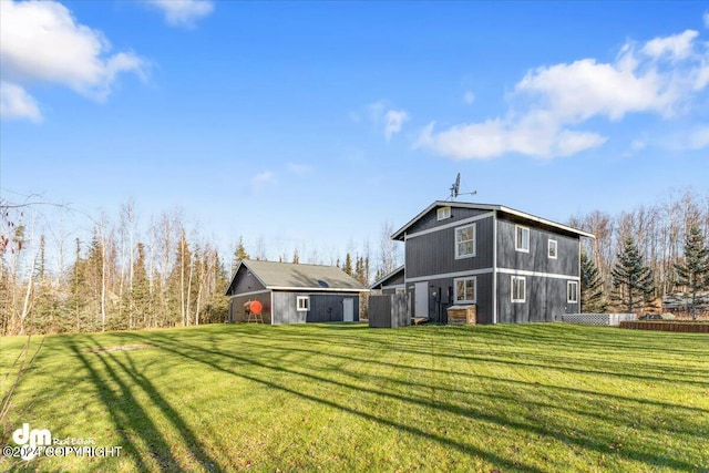 back of house featuring a lawn