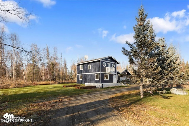 view of side of property featuring a yard