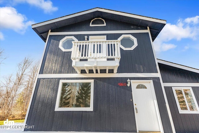 view of front of property with a balcony