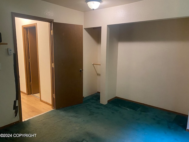 unfurnished bedroom featuring light colored carpet