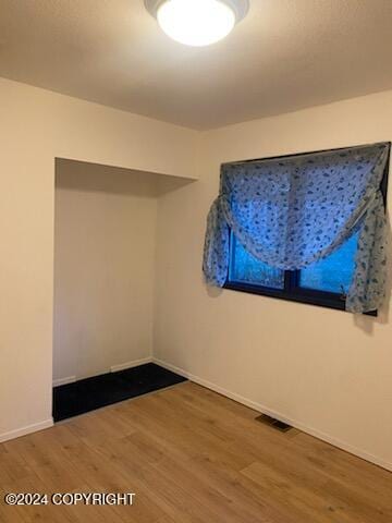 1915 Dora Way, Seward, AK 99664 - spare room featuring wood finished floors and baseboards