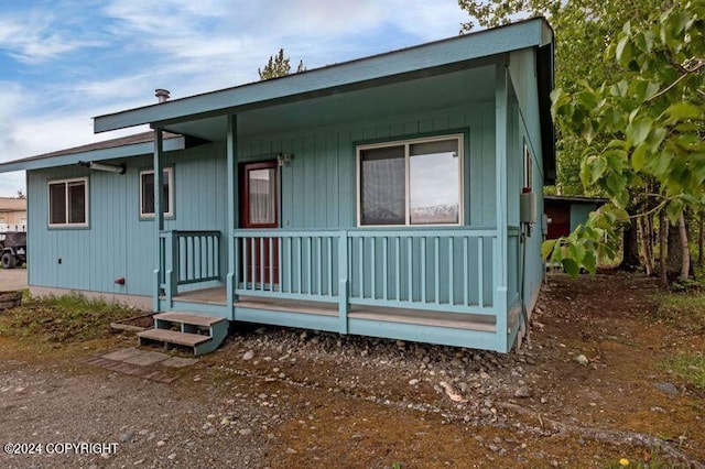 back of house with a porch