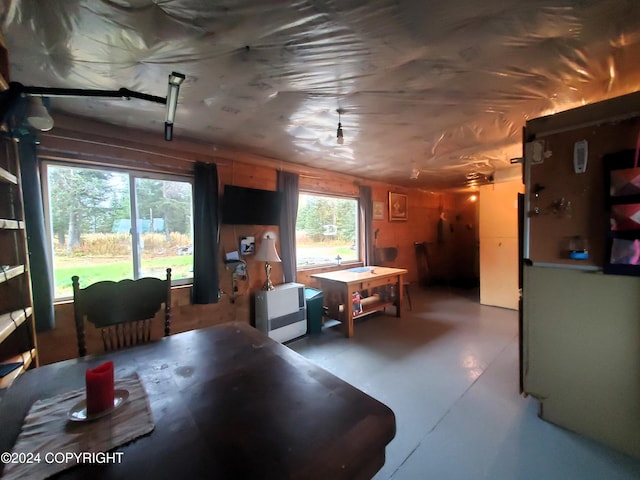 dining area featuring concrete floors