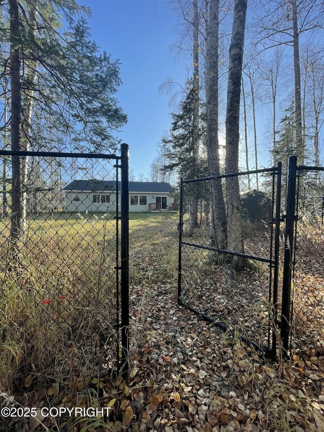 view of gate with fence